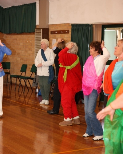 Seniors-bollywood-dance-with-hands-on-heads